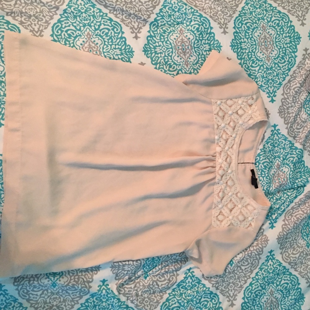 A pastel pink blouse