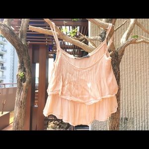 Short and flowy cream colored top