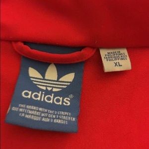 XL red adidas. Fits like a large
