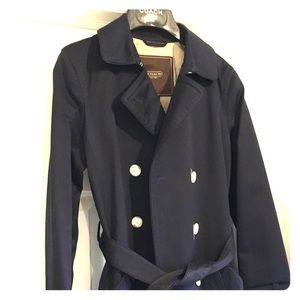 Gently used small navy Coach trench coat.