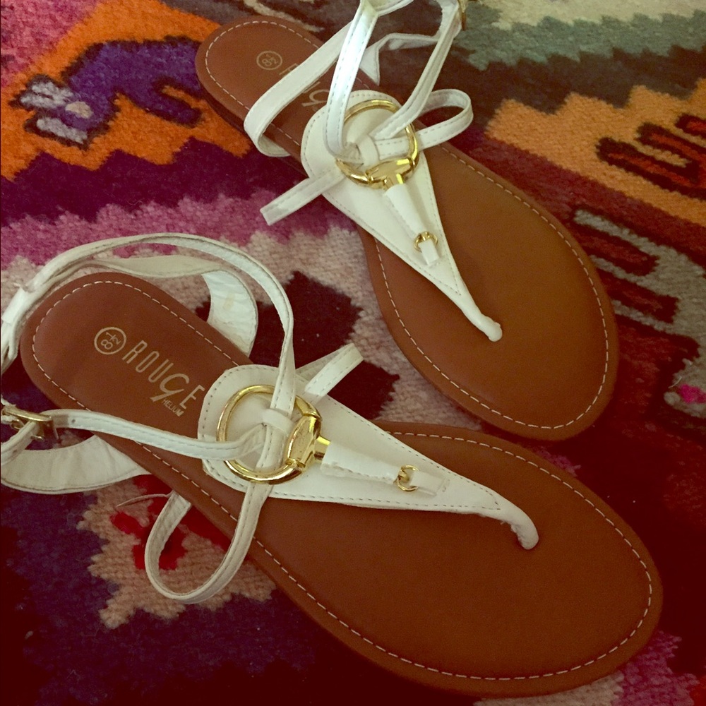 White size 8.5 women's thong sandals.
