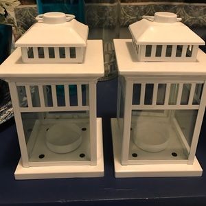 Tea light lanterns with a beautiful white finish .