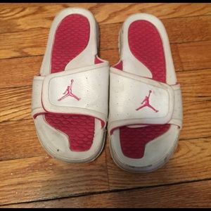 Pink and white Jordan slides/ slip ons.