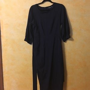 Dress with side pockets and wrap belt.