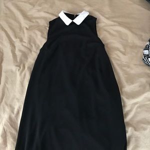 Black halter dress with a white collar