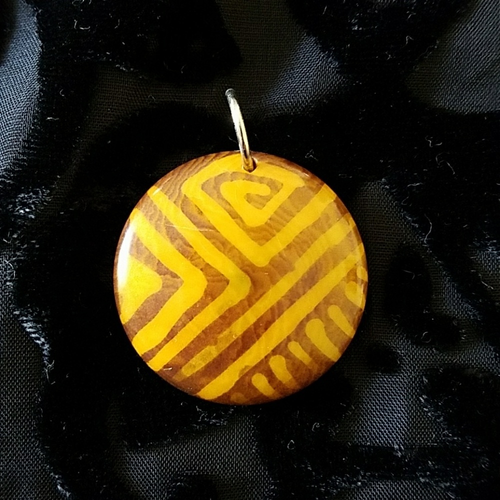 Tribal look horn pendant.