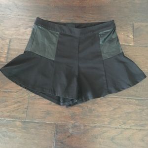 Shorts with faux leather panels.