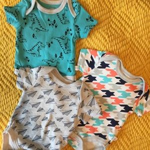 Set of three retro onesies.