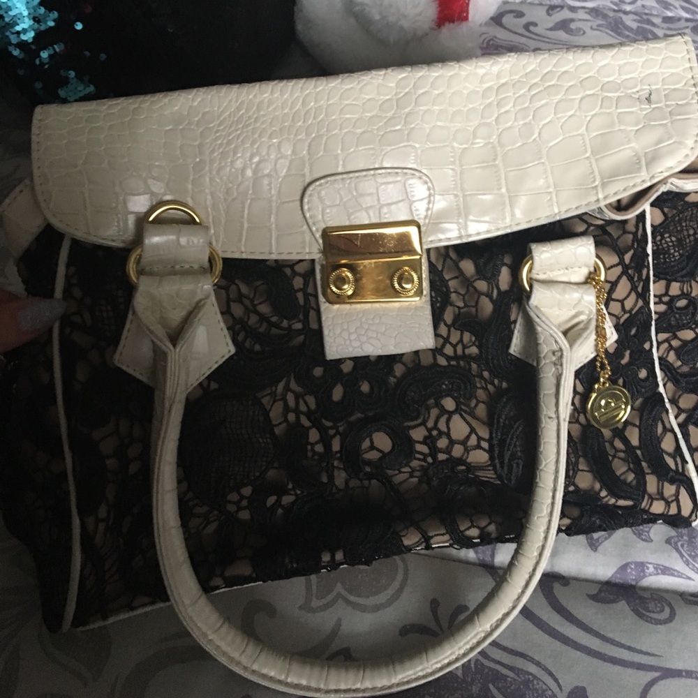 Slightly used big Buddha brand lace purse