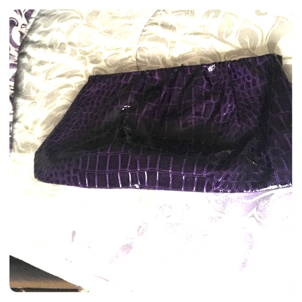 Purple crocodile textured clutch