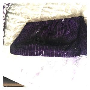 Purple crocodile textured clutch