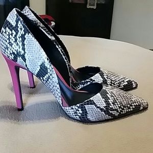 Snakeskin heels with a hot pink suede heel