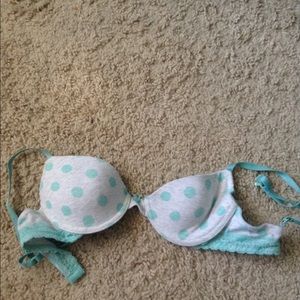 A teal and gray polka dot bra