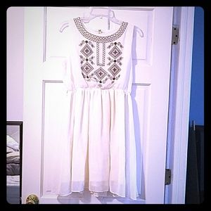 White dress with navy blue embroidery