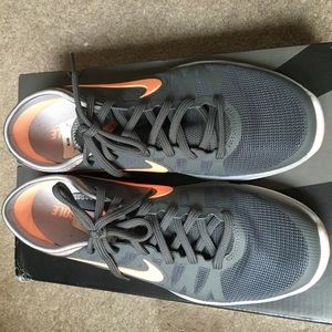 Grey and orange Nike Women's Flex Supreme TR3
