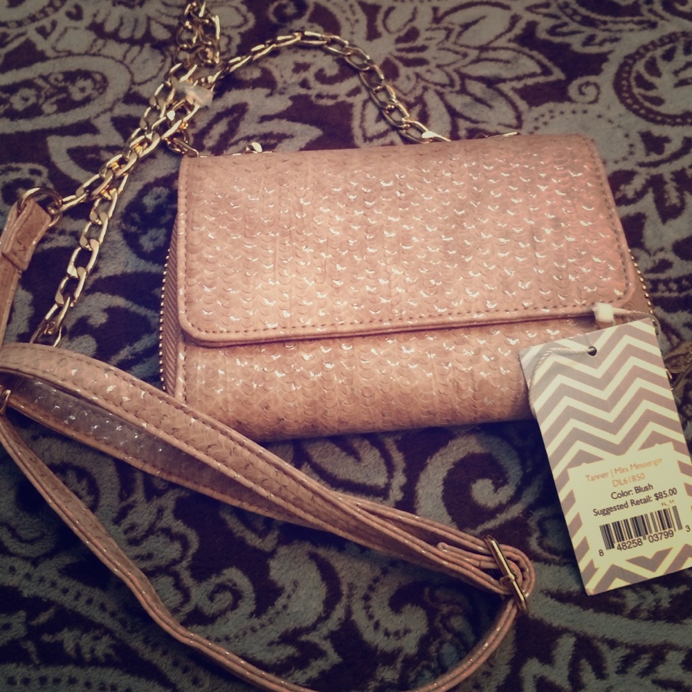Deux lux champagne and gold tone crossbody bag.