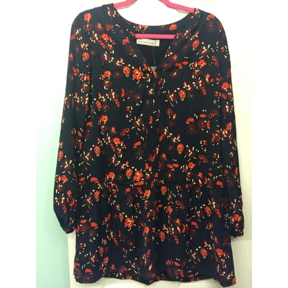 Navy blue long sleeve dress with a floral print