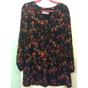 Navy blue long sleeve dress with a floral print