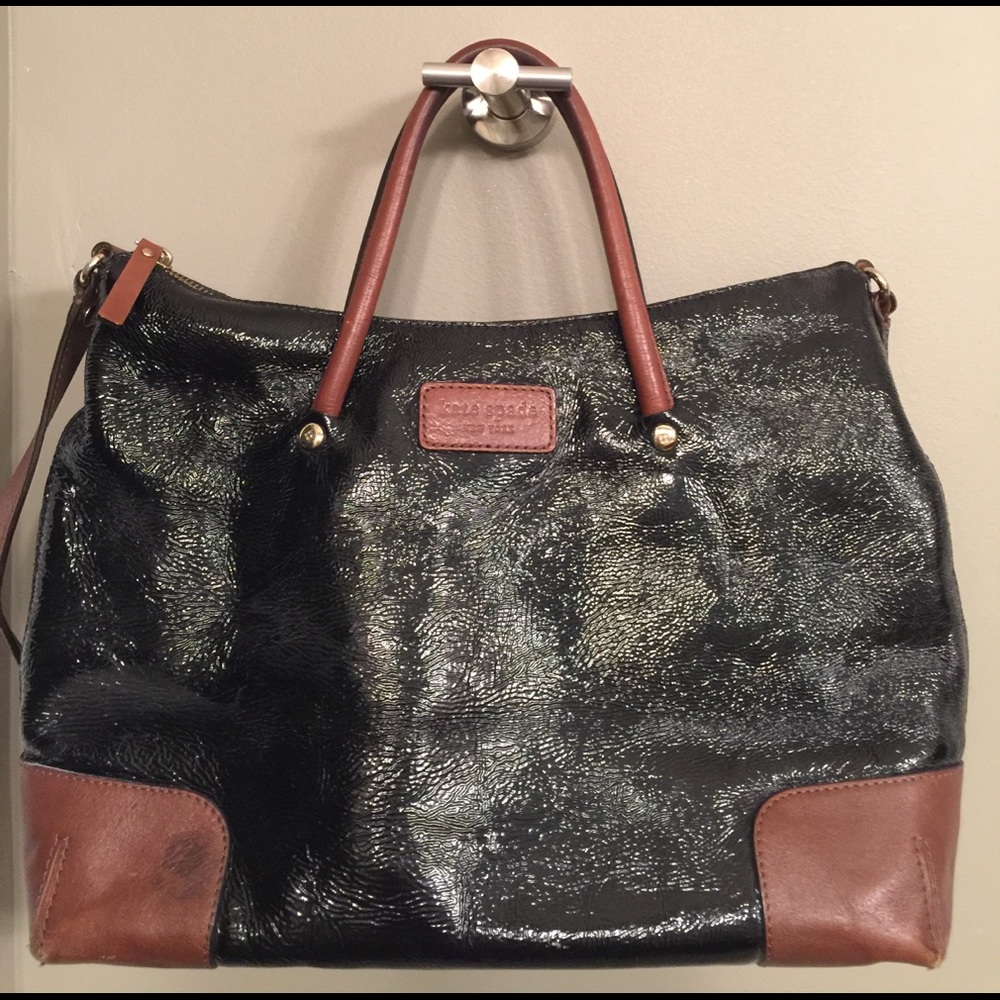 Kate Spade black shiny purse/brown leather detail
