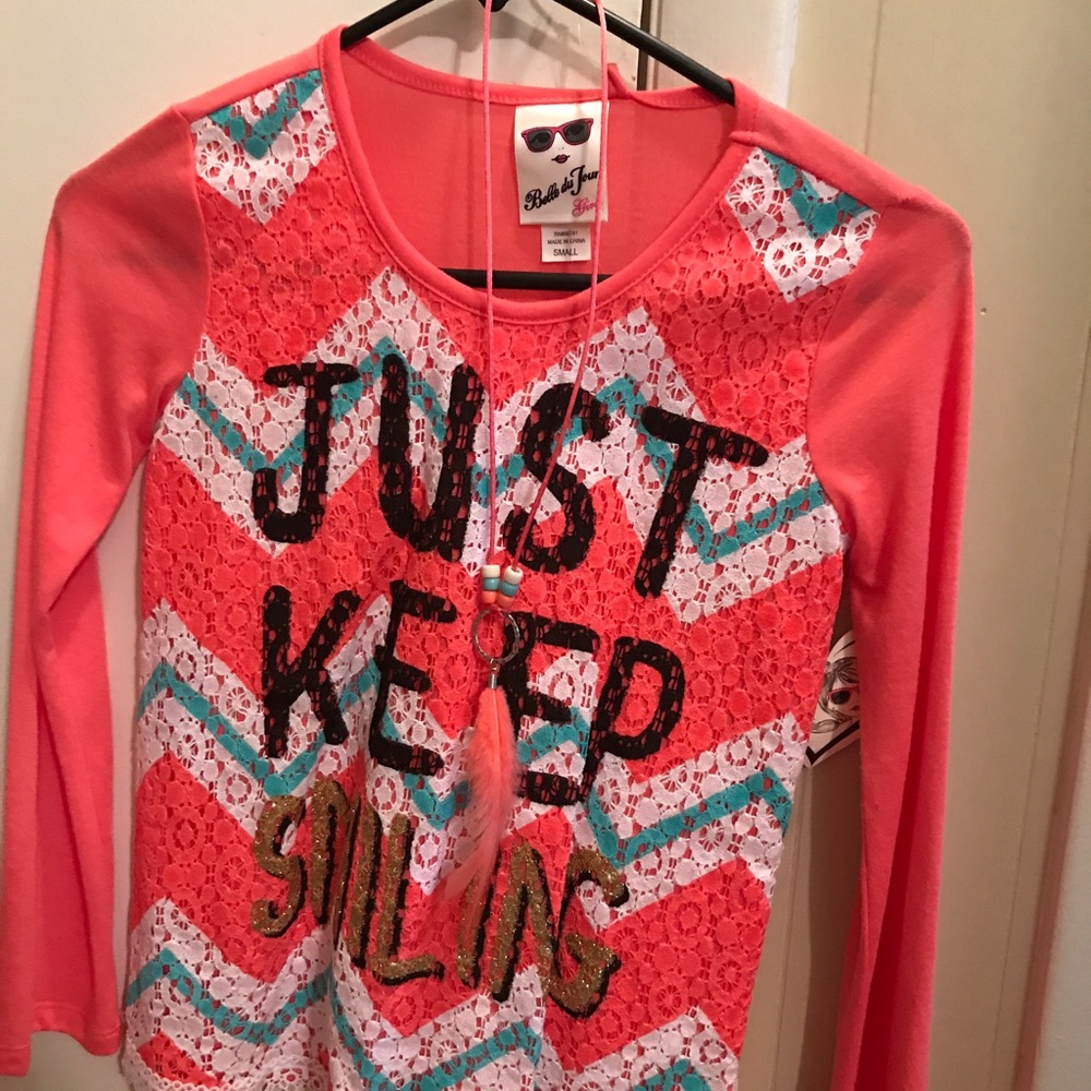 New with tags. Size small. Includes necklace