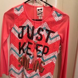 New with tags. Size small. Includes necklace