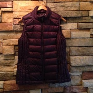 Eggplant purple colored weatherproof puffer vest.