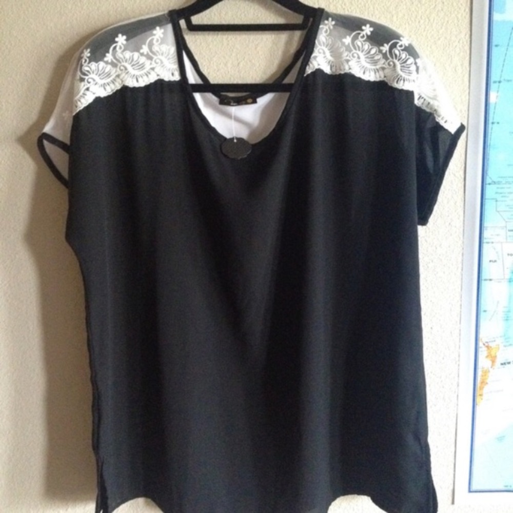 Black top with white laced sleeves
