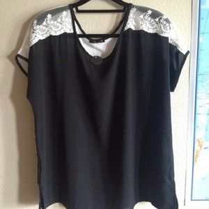 Black top with white laced sleeves