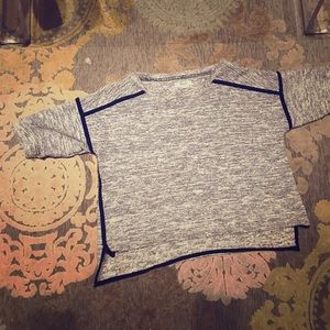 Quarter length sleeves- cropped sweater.
