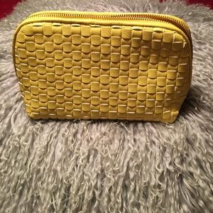 Yellow braided cosmetic bag