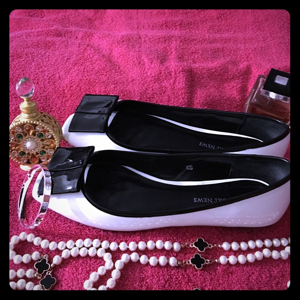 Black and white patent leather shoes.