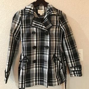 Women's plaid, water resistant trench coat.
