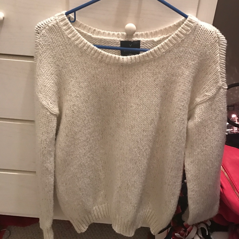 White and gold sweater