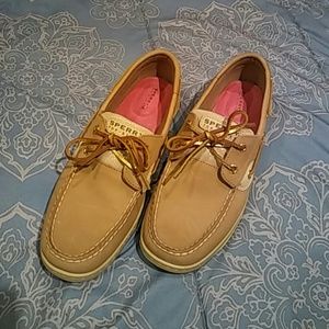 Woman's Sperry Topsiders with gold glitter.