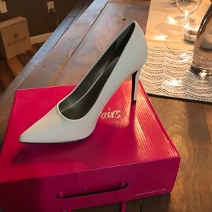 Brand NEW women's white pumps.