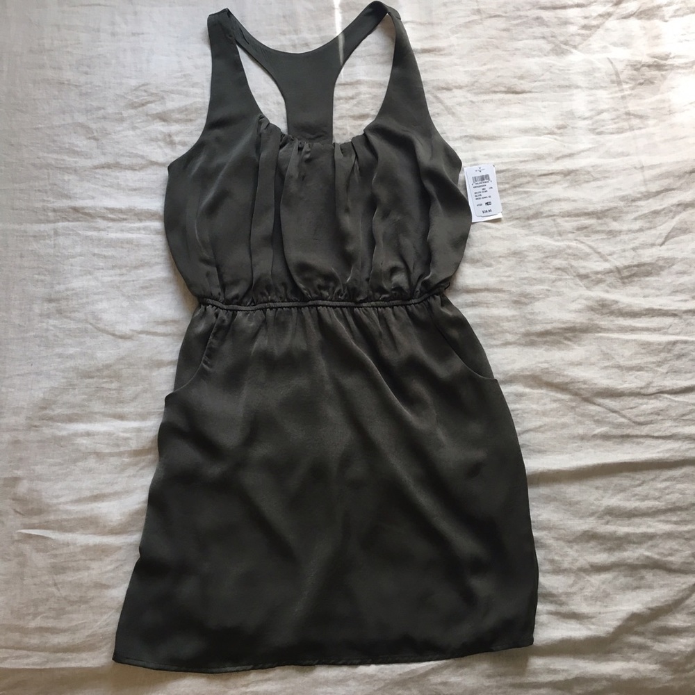 Never worn, light green racer back dress.