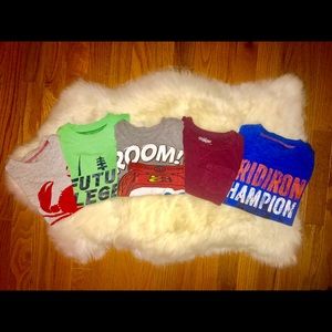 five red, blue, gray and green crew neck shirts