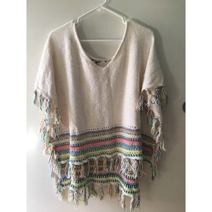 Women's Roxy Cream Poncho Top w/ colored stripes.