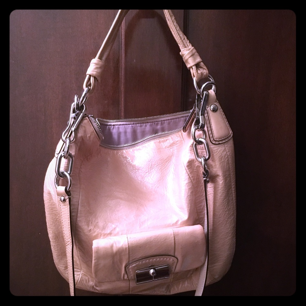 Coach beige/off white patent cross body purse.