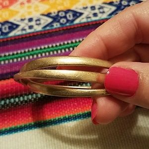Gently used Kenneth Cole gold bangles