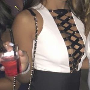 White with black cross cross straps body suit