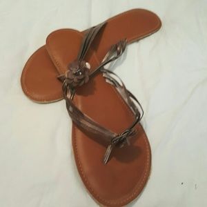 Roxy bronze flip flops size 10