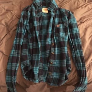 Long blue Button up shirt.