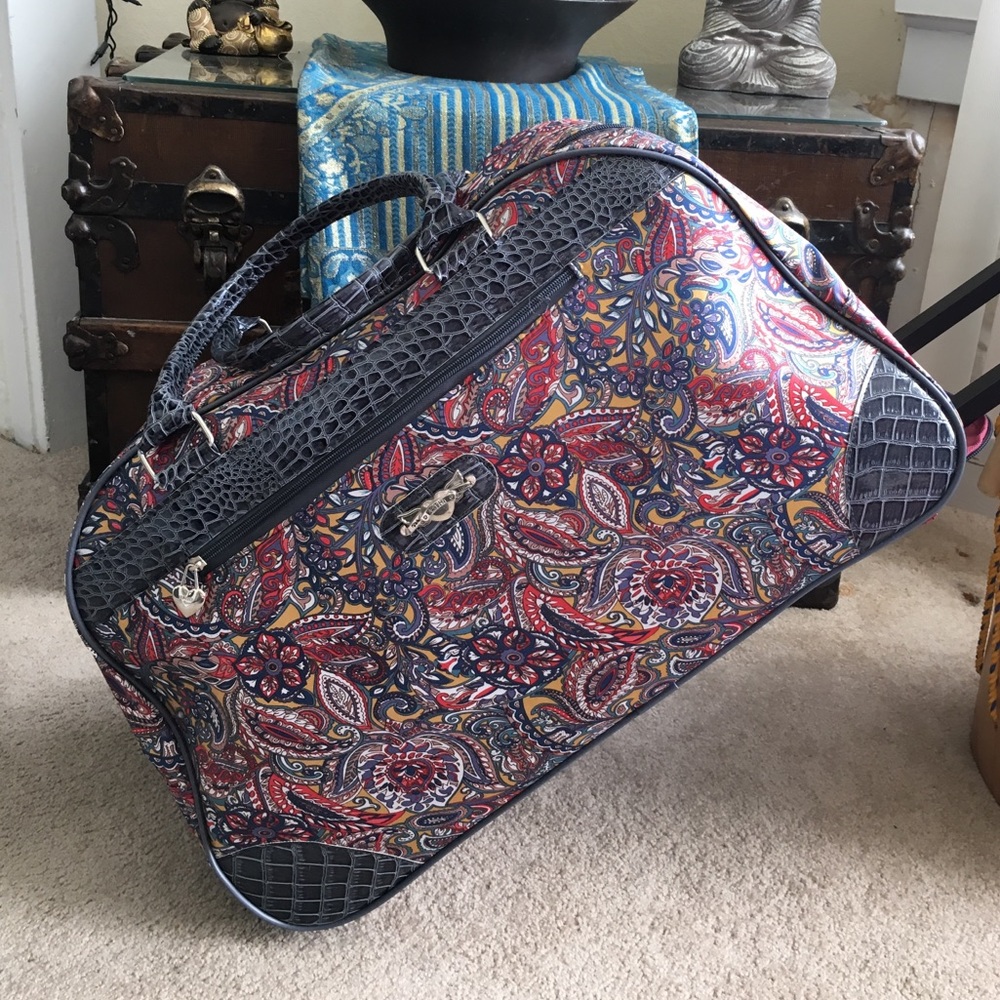 Super cute Kathy Van Zeeland rolling travel bag.