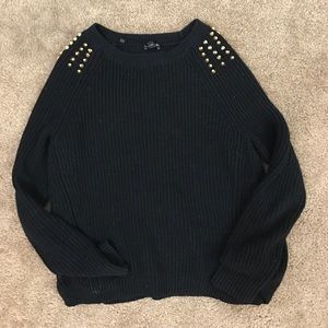 Black sweater with gold spikes on shoulders