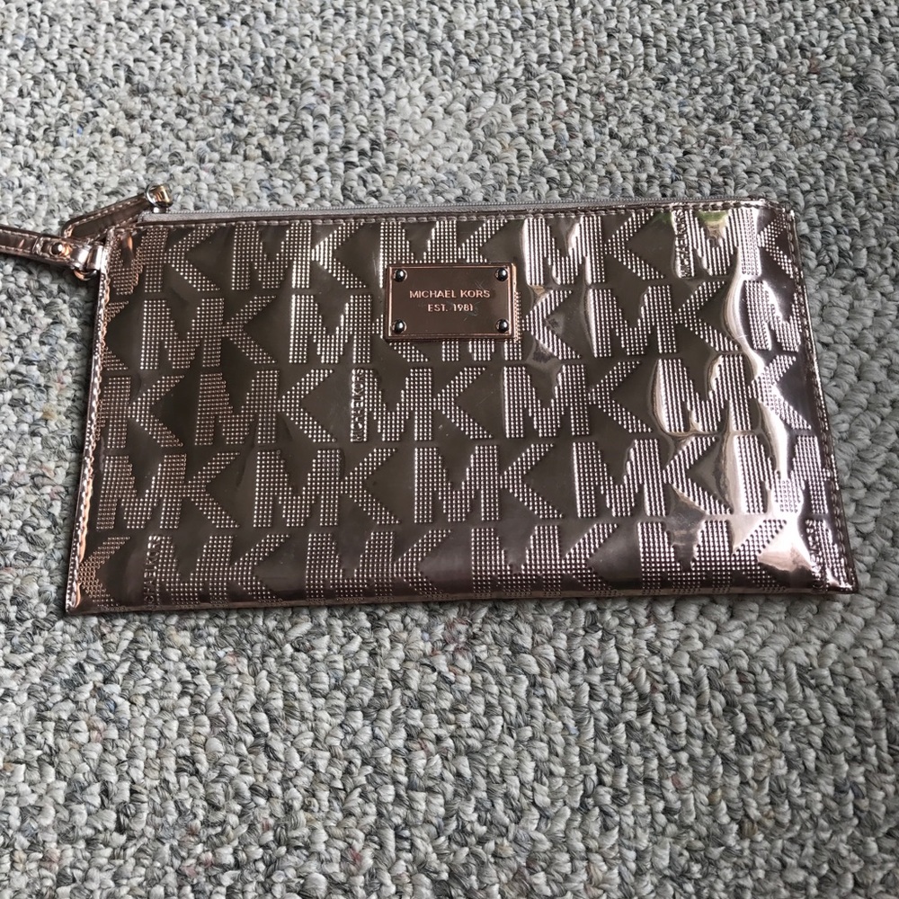 Michael Kors rose gold logo oversized wristlet