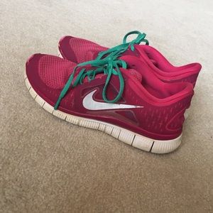 Used pink Nike free runs