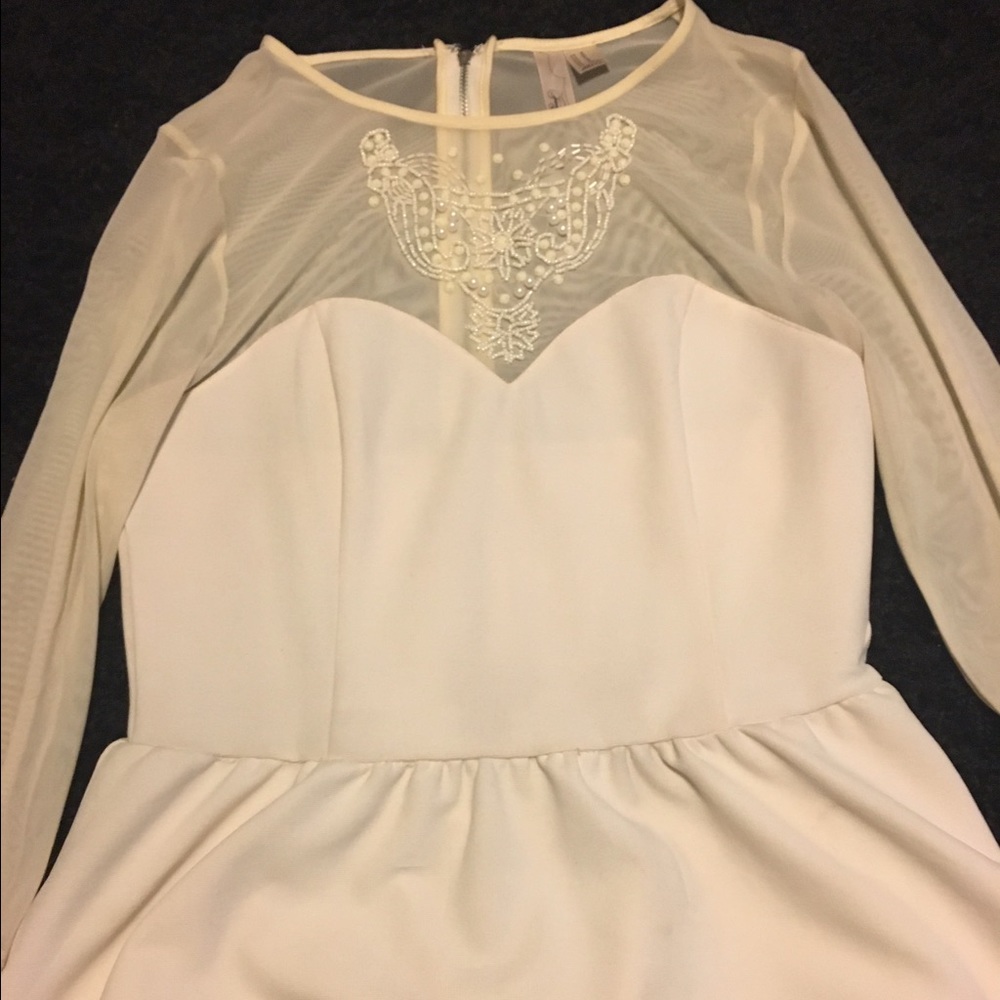 Cream long sleeved blouse