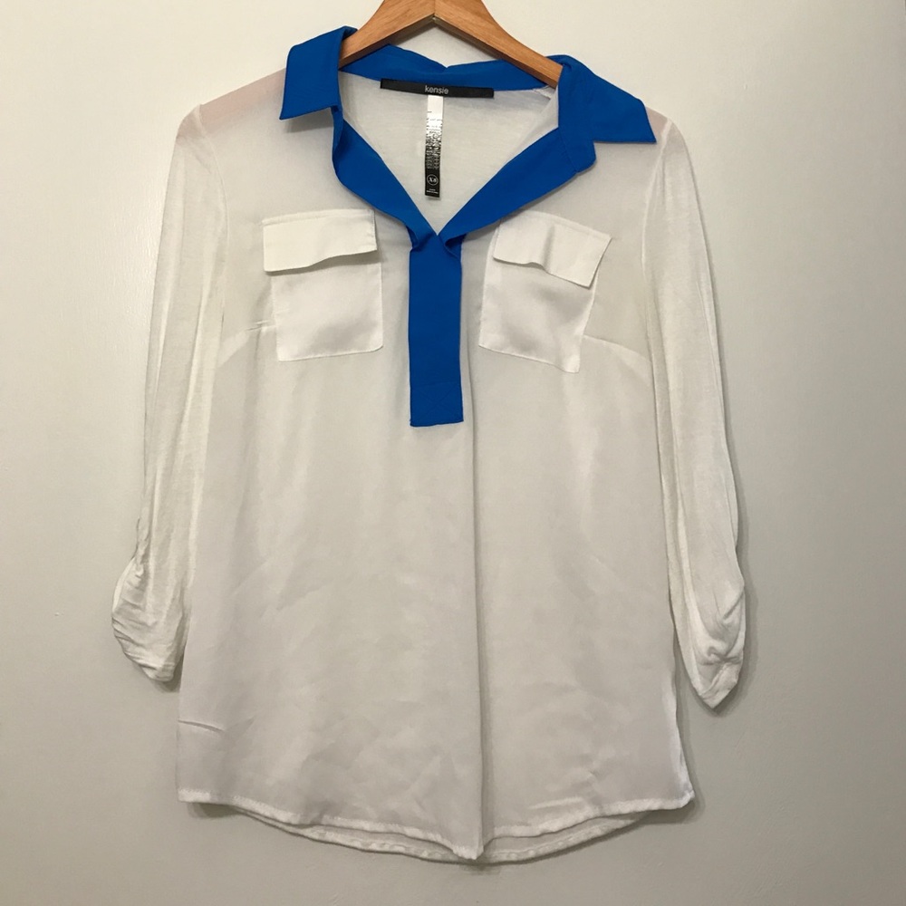 White and blue collared top.