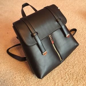Black leather backpack w/ gold accents